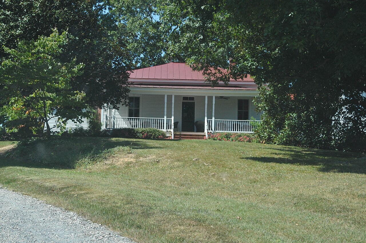 Zehmer Farm house partly shaded by mature trees