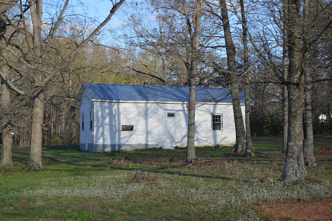Former Hill Grove School seen through trees