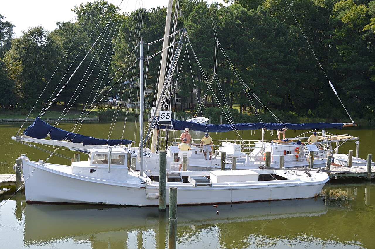 Claud W. Somers skipjack moored with other boats in Reedville