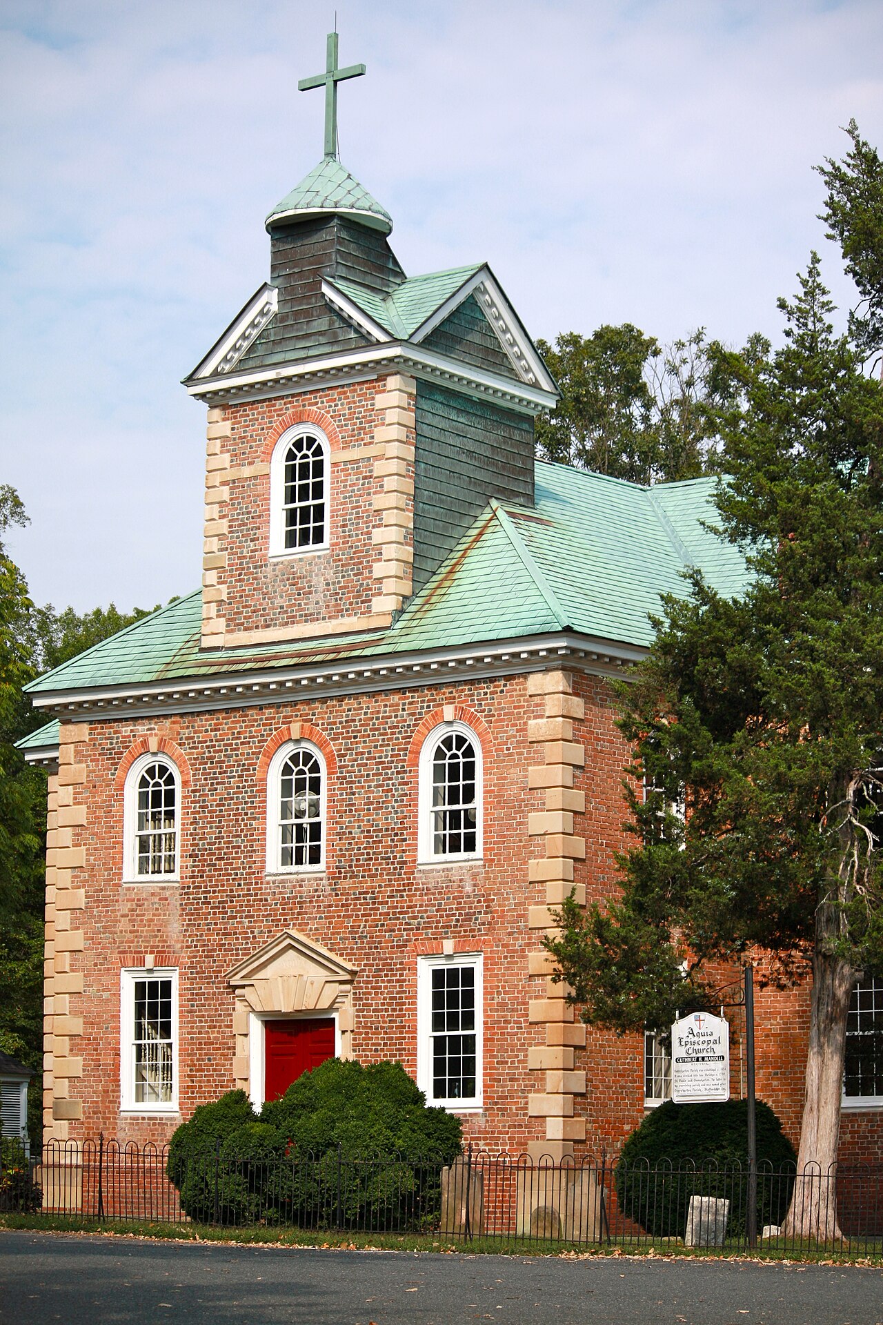 Brick tower and green roof of Aquia Church