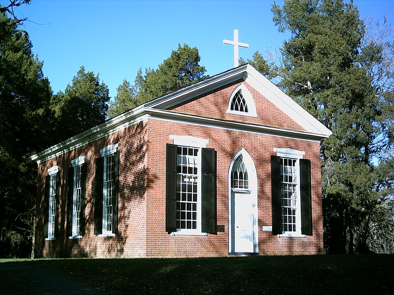 Brick Grace Church at Ca Ira beneath trees